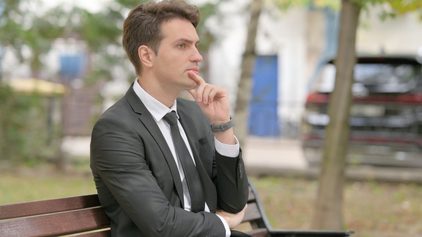 Man contemplating outdoors